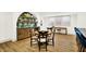 The finished basement boasts a wet bar with ample storage and a round table surrounded by floral chairs at 19795 Chatham Shore Ln, Westfield, IN 46074