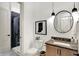 Stylish powder room with a modern mirror, decorative lighting and modern fixtures at 19795 Chatham Shore Ln, Westfield, IN 46074