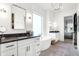 Beautiful primary bathroom featuring double vanities, free-standing tub, and stylish fixtures at 19795 Chatham Shore Ln, Westfield, IN 46074