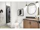 Modern bathroom featuring a glass shower, sleek lighting, and wood-grain vanity at 19795 Chatham Shore Ln, Westfield, IN 46074