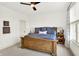 Charming bedroom features natural light, a queen bed, and decorative lamps on the night stands at 19795 Chatham Shore Ln, Westfield, IN 46074