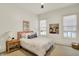 Bright bedroom with a pink headboard and cow painting at 19795 Chatham Shore Ln, Westfield, IN 46074