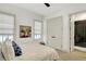 Bright bedroom with a cow painting and an ensuite bathroom at 19795 Chatham Shore Ln, Westfield, IN 46074