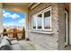 The covered patio features a serving bar and exterior brick accents at 19795 Chatham Shore Ln, Westfield, IN 46074