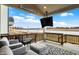 Enjoy outdoor living with views from the covered patio with mounted TV at 19795 Chatham Shore Ln, Westfield, IN 46074