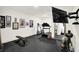 Bright exercise room features a treadmill, bike, free weights, and mounted TV at 19795 Chatham Shore Ln, Westfield, IN 46074