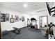Home gym is equipped with weights, a treadmill, and mirrored wall for a complete workout space at 19795 Chatham Shore Ln, Westfield, IN 46074