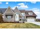 Charming two-story home with brick and siding, complemented by a well-manicured front lawn at 19795 Chatham Shore Ln, Westfield, IN 46074