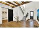 Bright foyer featuring hardwood floors, a staircase, and a modern design with ample natural light at 19795 Chatham Shore Ln, Westfield, IN 46074