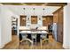 Spacious kitchen features a large island with seating and modern light fixtures and stainless appliances at 19795 Chatham Shore Ln, Westfield, IN 46074