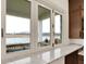 Bright kitchen pass-through window with marble countertop and stunning backyard lake views at 19795 Chatham Shore Ln, Westfield, IN 46074