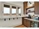 Kitchen pass-through window to the deck with cabinets and shelves at 19795 Chatham Shore Ln, Westfield, IN 46074