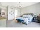 Comfortable main bedroom featuring paneled walls, a chandelier, and carpeted floors at 19795 Chatham Shore Ln, Westfield, IN 46074