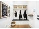 Mudroom features custom built-ins, stylish decor, and beautiful hardwood floors at 19795 Chatham Shore Ln, Westfield, IN 46074