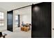 Office space has dual barn door entrance and view into an upstairs bonus room, offering natural light at 19795 Chatham Shore Ln, Westfield, IN 46074