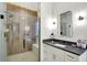 This is a modern-style shower, with glass walls and wood-look tile at 19795 Chatham Shore Ln, Westfield, IN 46074