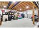 Unfinished basement storage area with exposed ceiling, water heater, and plenty of shelving and floor space at 19795 Chatham Shore Ln, Westfield, IN 46074