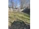 Large backyard with grass and a wooden fence for privacy at 2027 E Werges Ave, Indianapolis, IN 46237