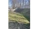 Grassy backyard featuring a long wooden fence at 2027 E Werges Ave, Indianapolis, IN 46237