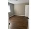 Bedroom with hardwood flooring, white trim, and window with blinds at 2027 E Werges Ave, Indianapolis, IN 46237