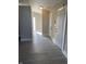 Entryway with gray wood-look tile flooring, neutral paint, and white trim at 2027 E Werges Ave, Indianapolis, IN 46237
