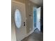 Inviting entryway features decorative glass front door and neutral paint at 2027 E Werges Ave, Indianapolis, IN 46237
