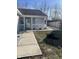 Well-maintained home with a covered porch, vinyl siding, and a walkway at 2027 E Werges Ave, Indianapolis, IN 46237