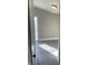 Hallway with grey wood-look tile flooring and neutral paint at 2027 E Werges Ave, Indianapolis, IN 46237