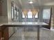 Bright breakfast nook with a view and adjacent kitchen area at 2122 George St, Anderson, IN 46016