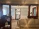 Open concept dining area, showing beaded curtains and dark wood trim at 2122 George St, Anderson, IN 46016