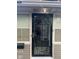 The main entrance features a custom security door and classic design at 2122 George St, Anderson, IN 46016