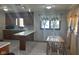 Cozy kitchen featuring wood cabinets and a breakfast bar with seating at 2122 George St, Anderson, IN 46016