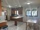Spacious kitchen and breakfast nook area with ample wooden cabinetry at 2122 George St, Anderson, IN 46016
