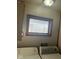 View of the laundry room with a window, washer, and dryer at 2122 George St, Anderson, IN 46016