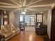 Cozy living room featuring hardwood floors, comfortable seating, and natural light at 2122 George St, Anderson, IN 46016