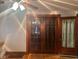 Living room with hardwood floors and detailed wood door frames and trim at 2122 George St, Anderson, IN 46016