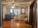 Inviting living room with hardwood floors, a ceiling fan, and neutral-colored furniture at 2122 George St, Anderson, IN 46016