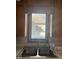 Stainless steel kitchen sink and fixtures beneath a window with an outside view at 2122 George St, Anderson, IN 46016