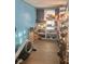 View of a storage room with shelves and blue walls at 2122 George St, Anderson, IN 46016