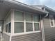 View of the sunroom with floor-to-ceiling windows and siding at 2122 George St, Anderson, IN 46016