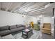 Finished basement featuring a living area with exposed ceiling at 2224 E Pleasant Run Parkway North Dr, Indianapolis, IN 46203