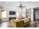 Bright living room with vaulted ceilings, stylish furniture, and modern decor at 2224 E Pleasant Run Parkway North Dr, Indianapolis, IN 46203