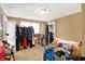 Bedroom featuring a clothes rack and cluttered floor space, illuminated by natural light at 2401 N Olney St, Indianapolis, IN 46218