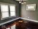 Comfortable bedroom featuring natural light, neutral walls and hardwood floors at 2401 N Olney St, Indianapolis, IN 46218