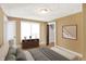 Comfortable bedroom featuring a dresser, a full-sized bed, and warm hues for a relaxing retreat at 2401 N Olney St, Indianapolis, IN 46218