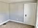 Bedroom with neutral walls, carpeting, and white trim at 2401 N Olney St, Indianapolis, IN 46218