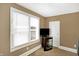 Bedroom featuring a TV on a small stand in front of a window with white blinds at 2401 N Olney St, Indianapolis, IN 46218