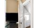Small bedroom featuring an open door to a closet with a window and a fan at 2401 N Olney St, Indianapolis, IN 46218