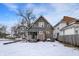 Traditional two-story home with a covered front porch and neutral siding at 2401 N Olney St, Indianapolis, IN 46218