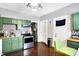 The kitchen features stainless steel appliances, wood countertops and green cabinetry at 2401 N Olney St, Indianapolis, IN 46218
